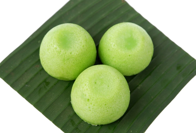 Putu Ayu cake on a banana leaf, isolated on a white background, Indonesian market food