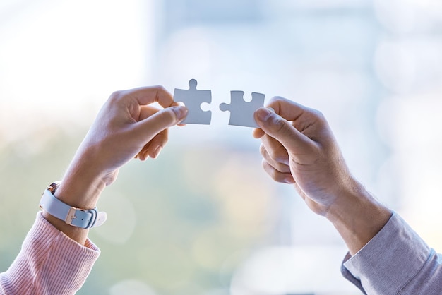 Puzzle collaboration and teamwork between business people hands after business meeting for partnership contract or merger Vision Innovation and corporate success after team work b2b strategy deal