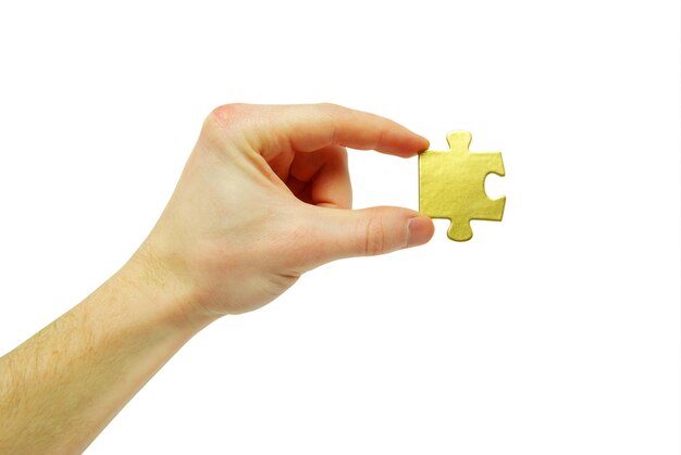 Puzzle in hand isolated on white background