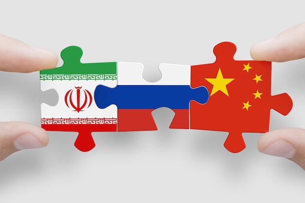 Puzzle made from flags of Iran Russia and China