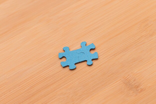 Puzzle pieces on wooden table