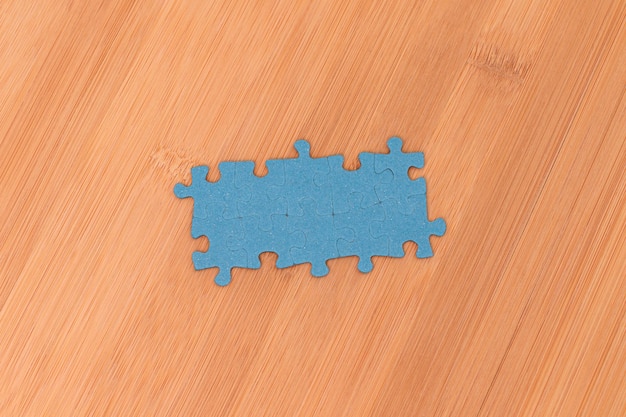 Puzzle pieces on wooden table