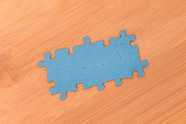 Puzzle pieces on wooden table