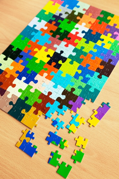 Puzzle with a pattern of colorful puzzle pieces