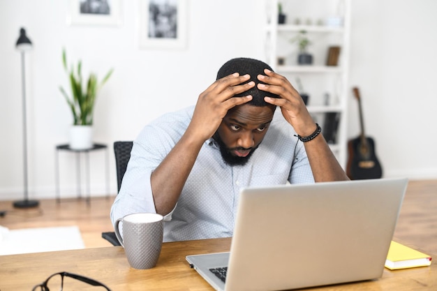 puzzled upset guy looks at the screen