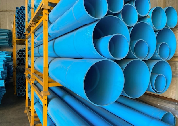 Photo pvc pipes stacking on shelf in warehouse