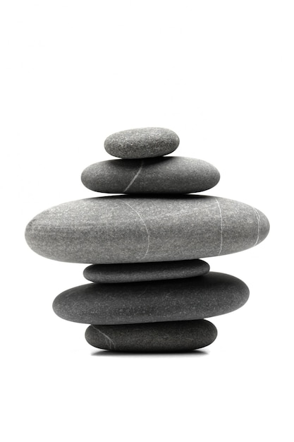 Pyramid of the balanced grey stones isolated on white background