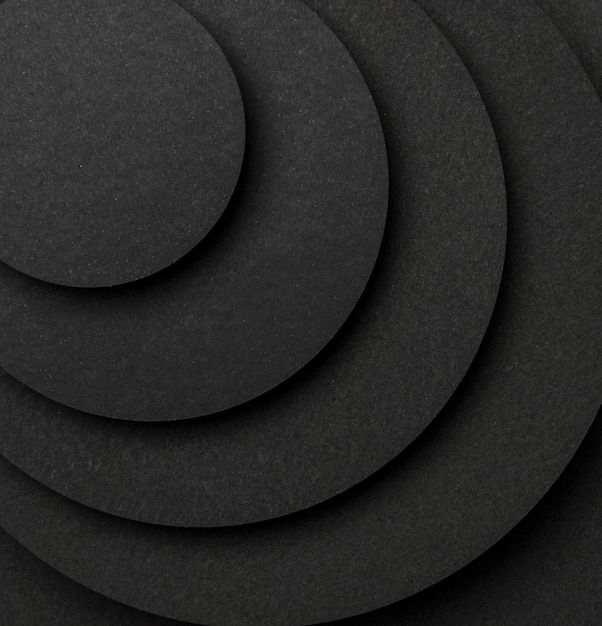 Photo pyramid of circular pieces of black paper close-up