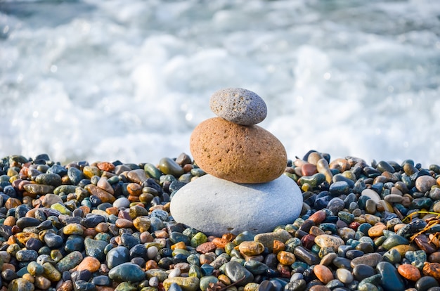 Pyramid from multi-colored stones on the Black Sea in Batumi, Georgia.