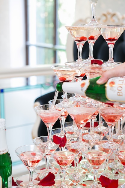 Pyramid of glasses for champagne or vine at the wedding party.