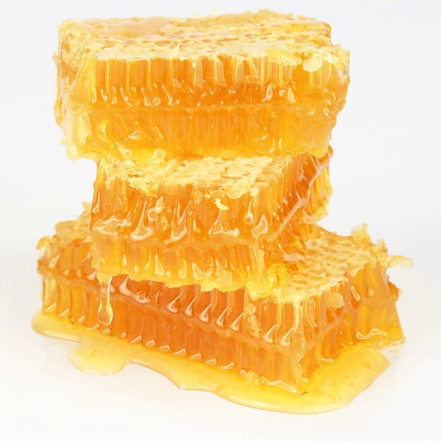 Pyramid of honeycomb on white background. Healthy and vitamin food