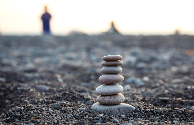 pyramid of pebbles with pebbles in sea