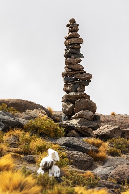 Pyramid of stones Apacheta in the valley Bolivia
