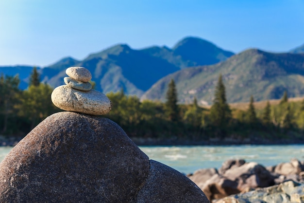 pyramid of stones built by tourists on the ulagan pass ulagansky district altai