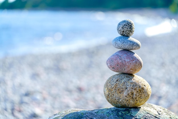 Pyramid of stones Unstable balance of stone objects Idyllic state of nature