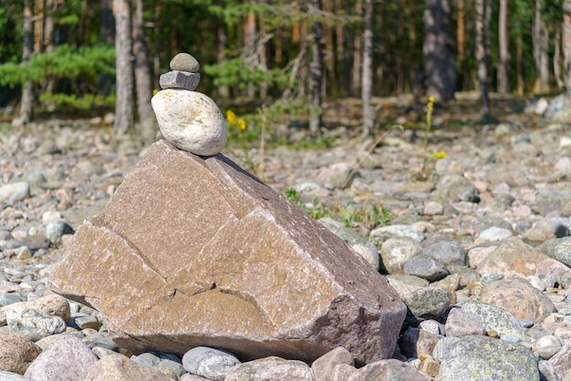 Pyramid of stones Unstable balance of stone objects Idyllic state of nature