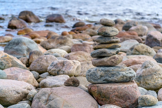 Pyramid of stones Unstable balance of stone objects Idyllic state of nature