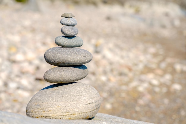 Pyramid of stones Unstable balance of stone objects Idyllic state of nature