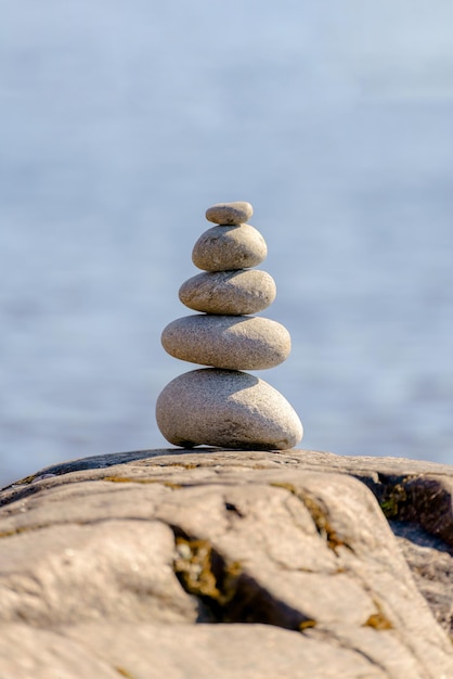 Pyramid of stones Unstable balance of stone objects Idyllic state of nature