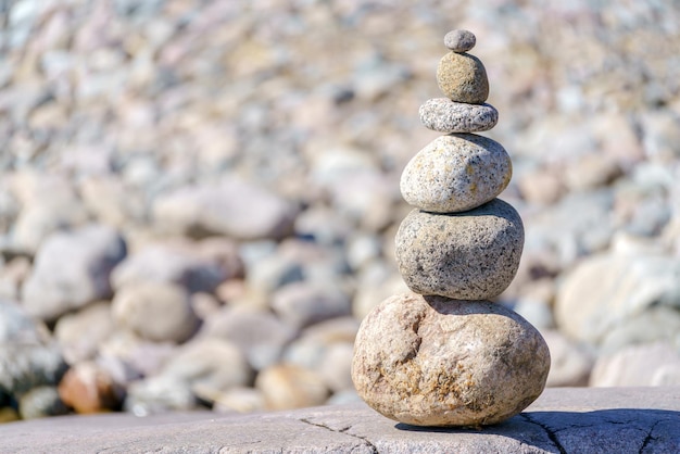 Pyramid of stones Unstable balance of stone objects Idyllic state of nature