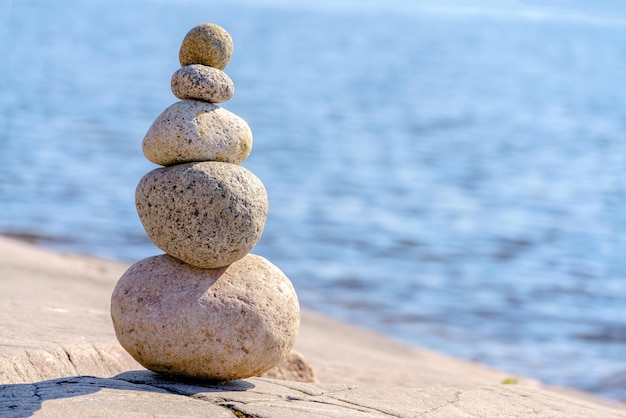 Pyramid of stones Unstable balance of stone objects Idyllic state of nature