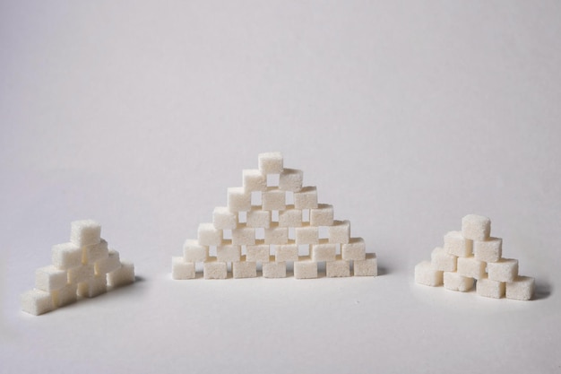 pyramid of sugar cubes on a white background. close-up