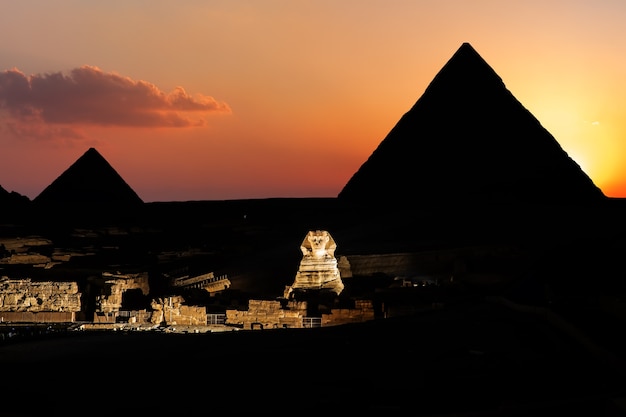 Pyramids and the Sphinx in twilight in Giza, Egypt.