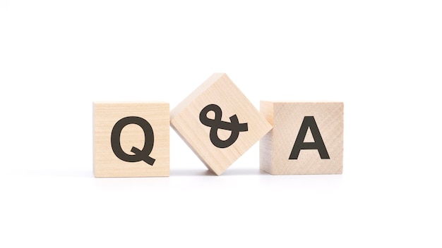 Q and A acronym from wooden blocks with letters Question and Answer concept top view on white background