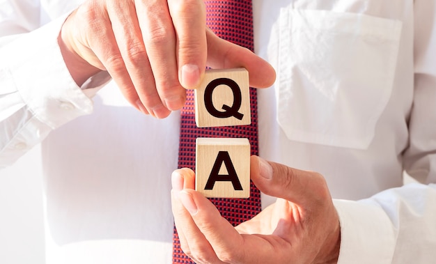 QA concept. Acronym of questions and answers or job of tester or quality engineer.