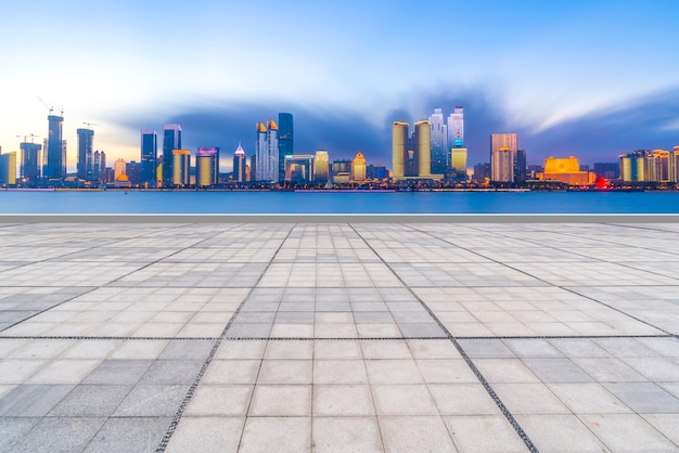 Qingdao city skyscrapers with empty square floor tiles