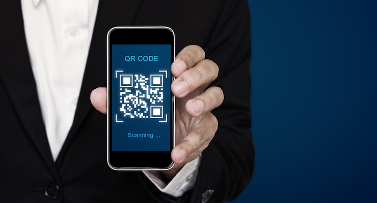 Photo qr code scanning payment and verification. businessman holding mobile phone scan qr code