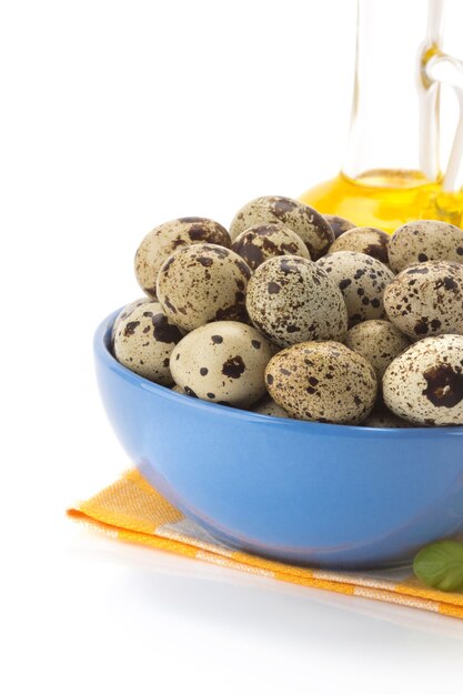 Quail egg in bowl isolated