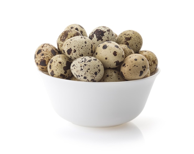 Quail eggs in bowl isolated