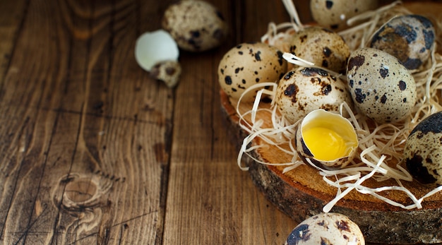 Quail eggs close up on a wooden  background