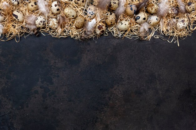 Quail eggs on a dark brown surface