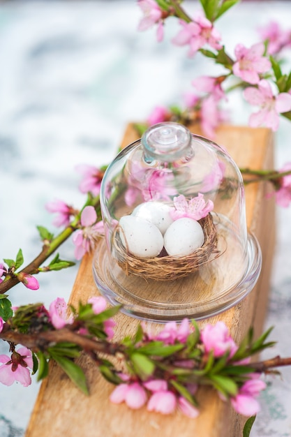 Quail eggs in a diy nest. Easter card in trendy color.