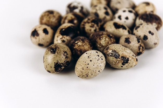 Quail eggs isolated on white background