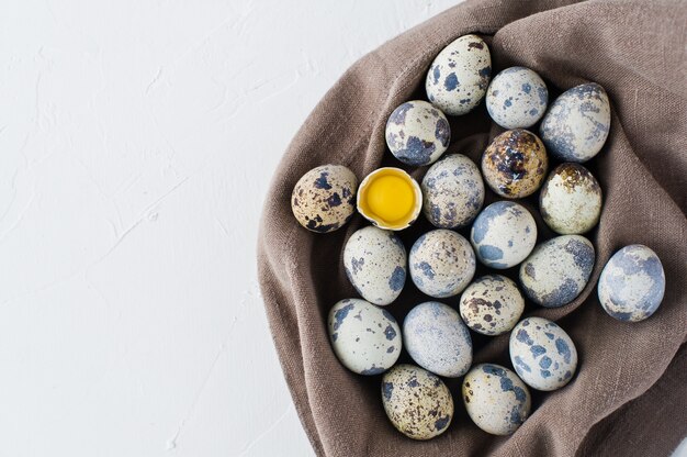 Quail eggs, one broken egg 