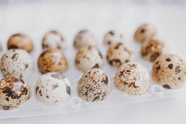 quail eggs in a package on a bright background for Easter