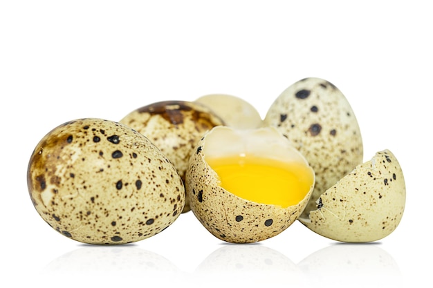 Quail eggs with broken one isolated on white background