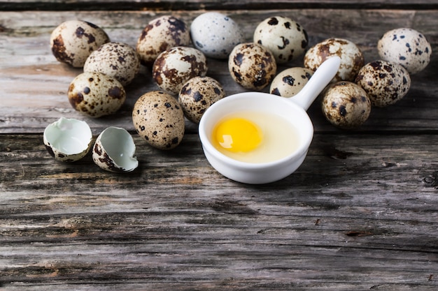 Quail eggs over wood