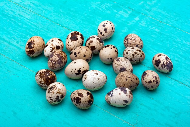 Quail eggs on wooden background