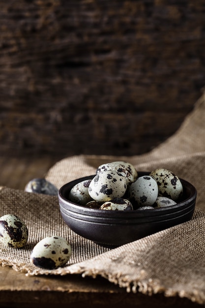 Quail eggs on wooden background