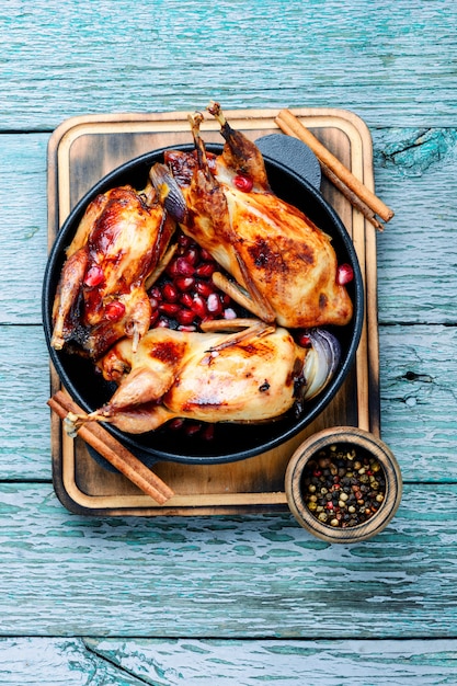 Quail fried in a frying pan