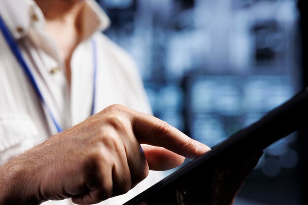 Photo qualified electrician inspects servers