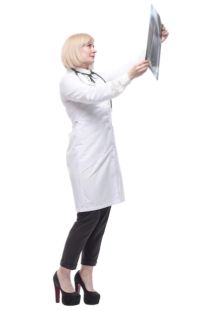 Qualified female doctor looking at an xray