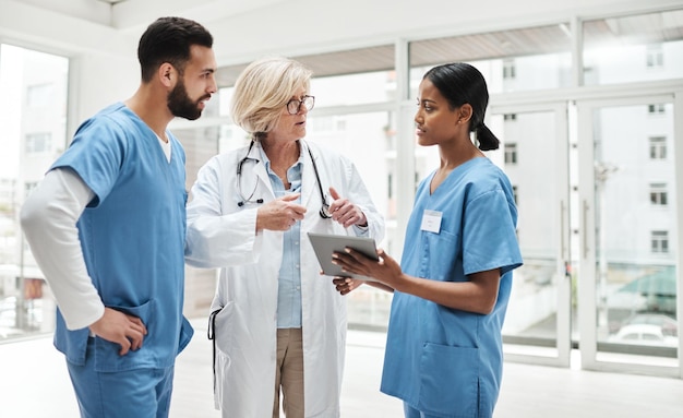 Quality healthcare is all about putting the patient at the centre Shot of a group of medical practitioners having a discussion in a hospital