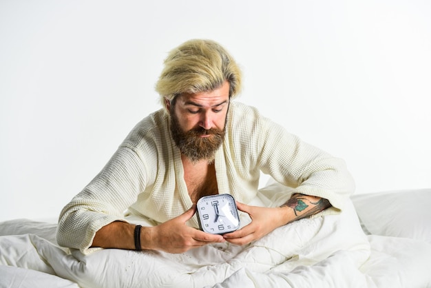 Quality of sleep you get is also important stressed man alarm
clock sleepy guy and alarm clock in bed bearded man with alarm
clock awakening concept sleep disorder healthy habits and
lifestyle