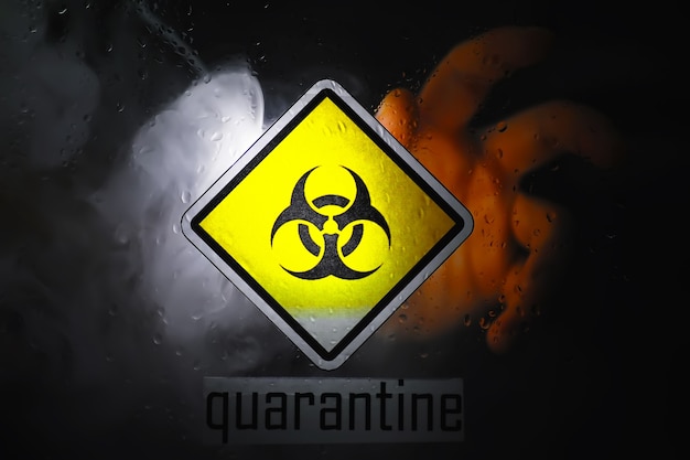 Quarantine. Quarantine warning sign on a glass door in a hospital isolator. Isolation of patients with the virus in special laboratories. Virus.