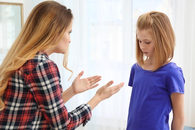 Photo quarrel between mother and daughter at home